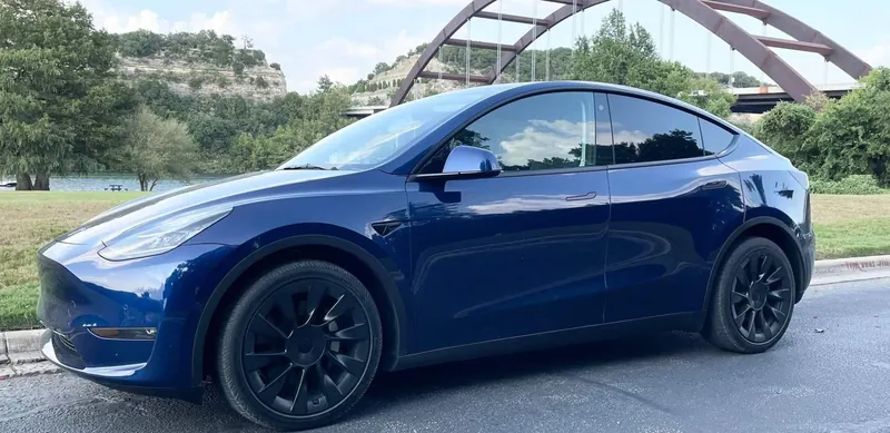 Blue Tesla Model Y parked in Austin